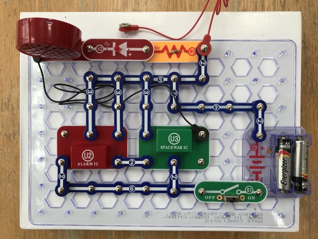 #38-Extension: Use Alarm IC to cycle through Spacewars Effects Sounds. Control volume by shorting components with Red terminal